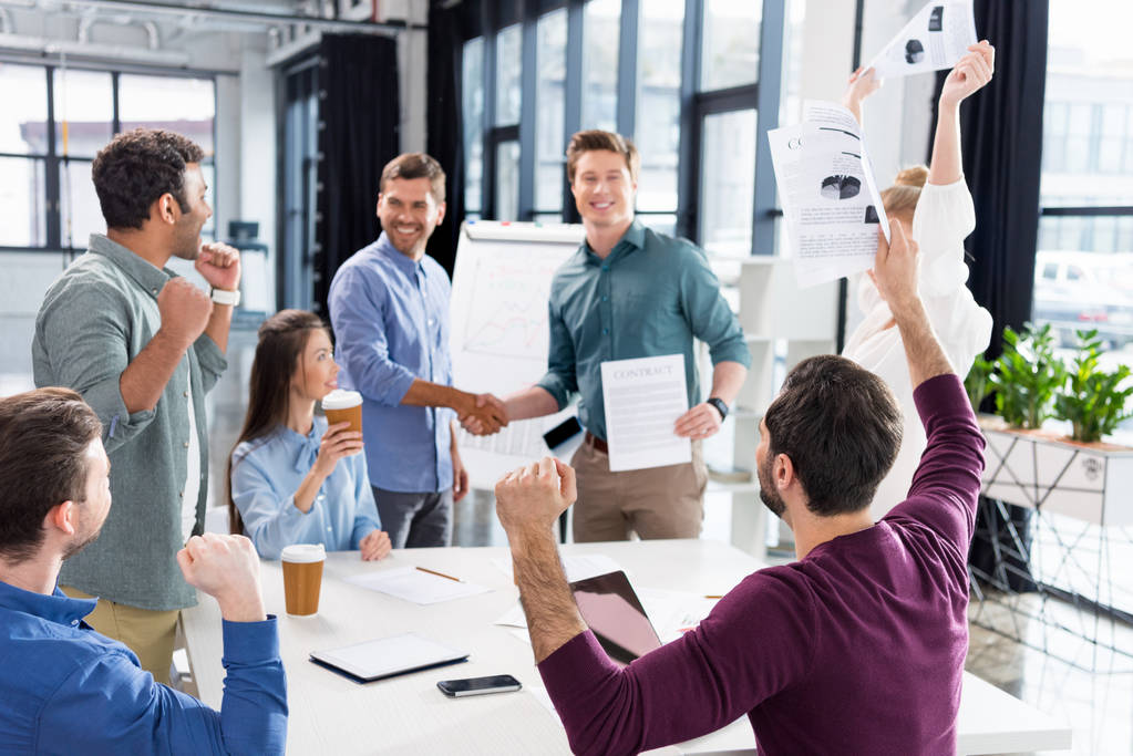 A business team celebrating success together